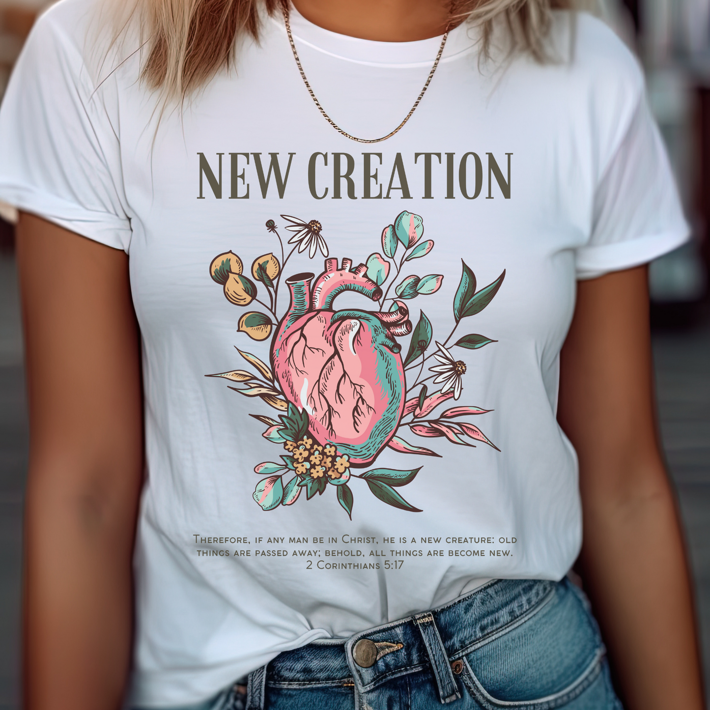 women wearing a white crewneck short sleeve modern womens christian shirt that says new creation in a boho style design