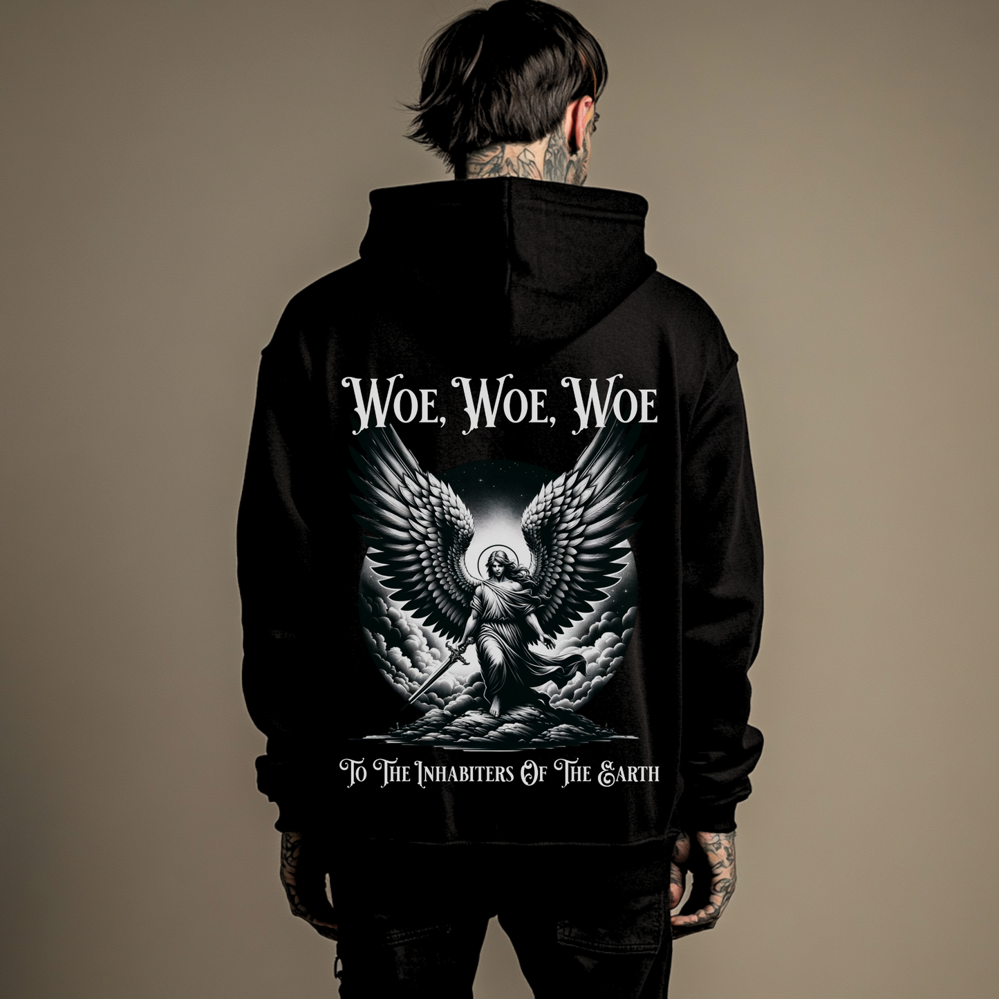 man wearing a christian graphic hoodie that says woe to the inhabiters of the earth from revelation in the bible