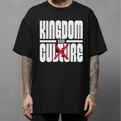 tattooed man wearing a christian streetwear tshirt that says kingdom over culture in bold lettering