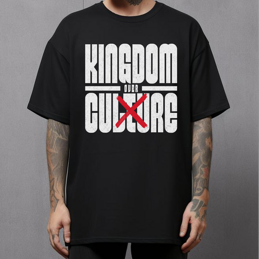 tattooed man wearing a christian streetwear tshirt that says kingdom over culture in bold lettering