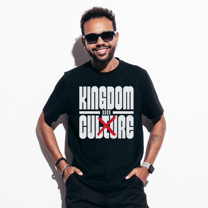 a man wearing a black crewneck short sleeve edgy christian shirt in a christian streetwear style that says kingdom over culture