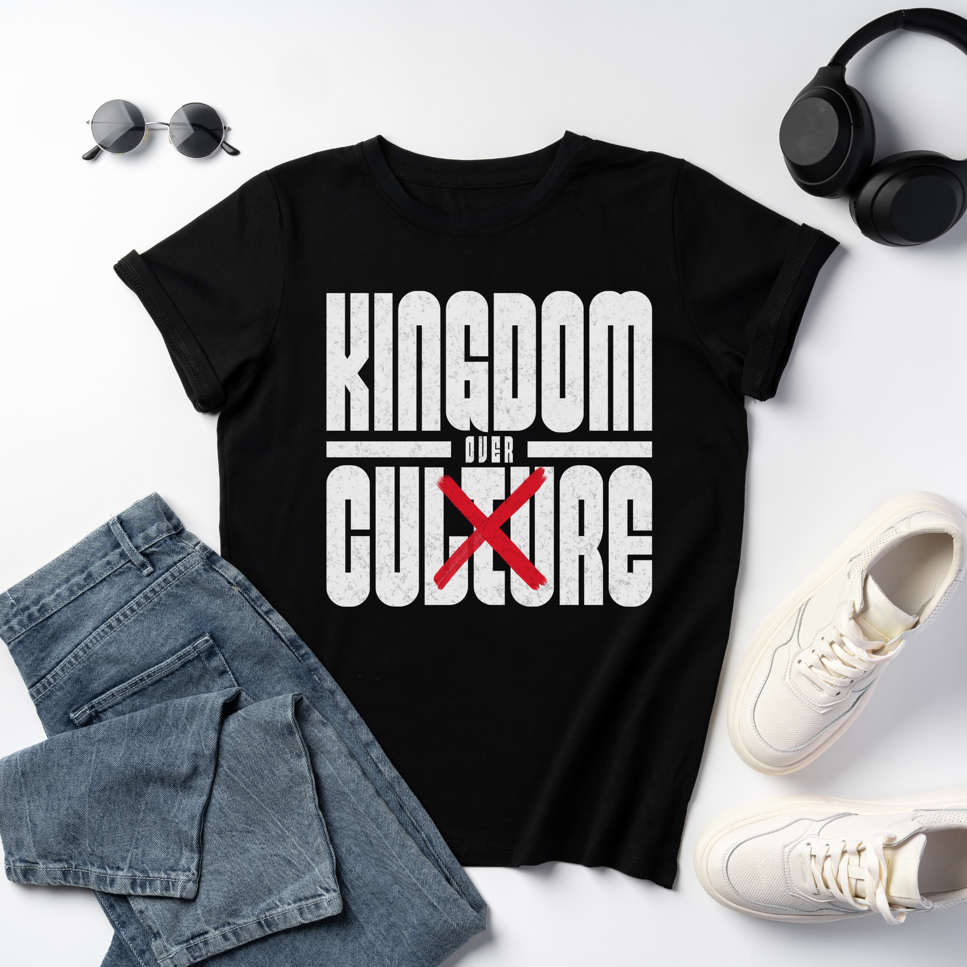 flat lay image of a unisex bold christian graphic tee with the text kingdom over cuture 