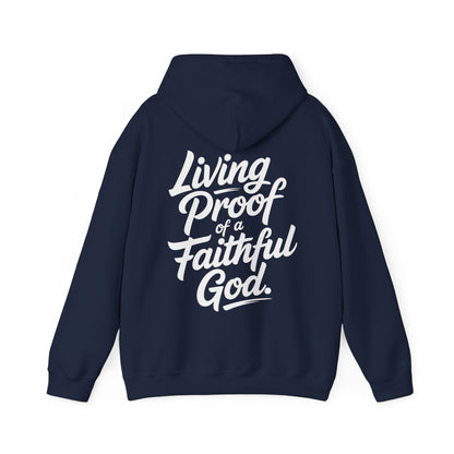Navy blue hoodie with white text 'Living Proof of a Faithful God' on the back against a white background