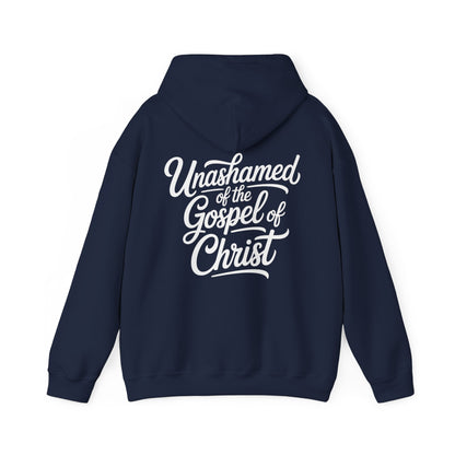 Navy blue gospel message hoodie with white text 'Unashamed of the Gospel of Christ' on a white background