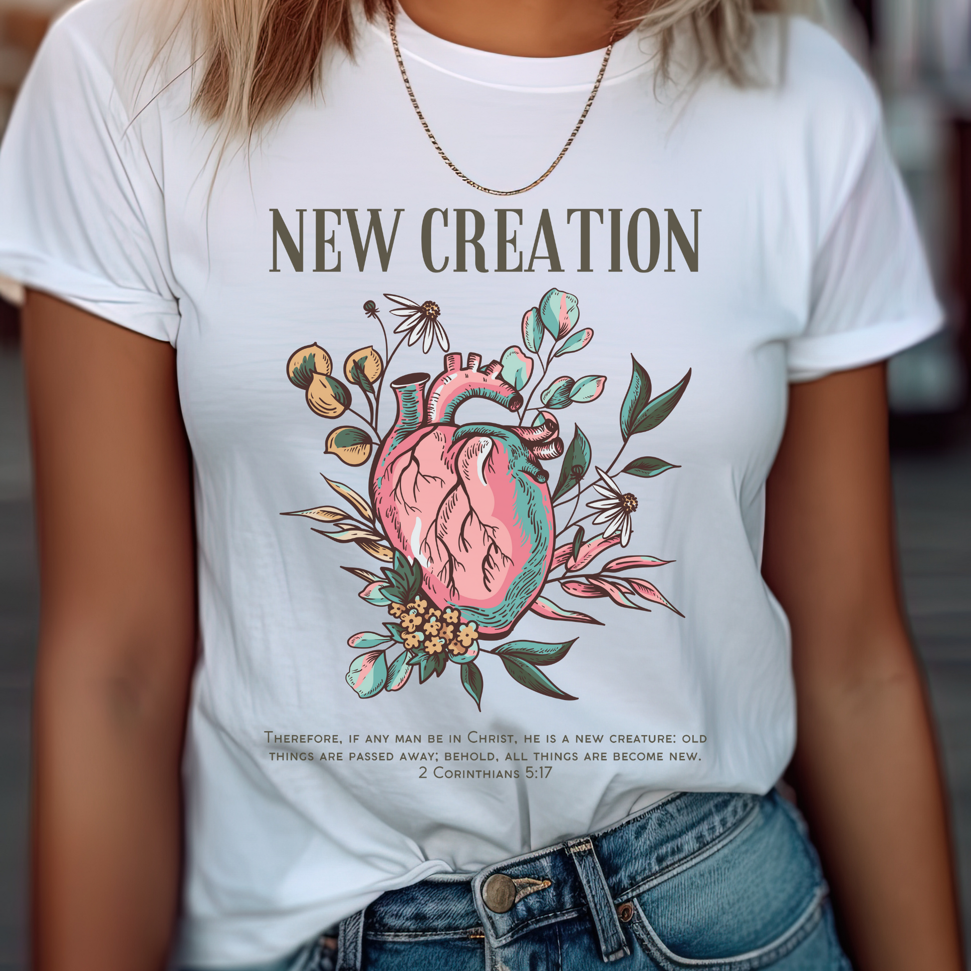 women wearing a white crewneck short sleeve modern womens christian shirt that says new creation in a boho style design