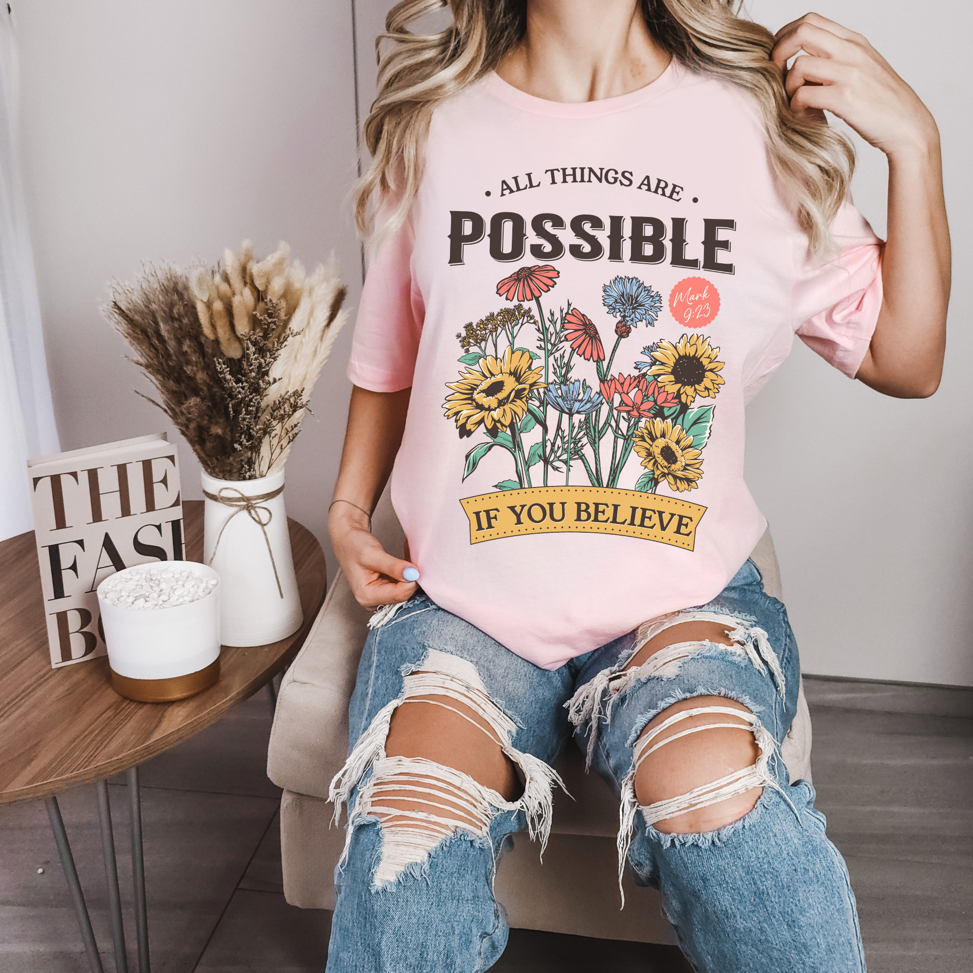 a woman wearing a soft pink bible verse shirt