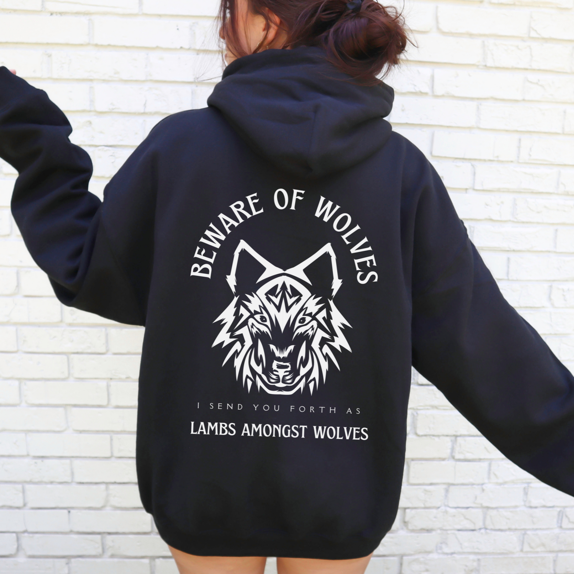 woman wearing an alternative christian hooded sweatshirt