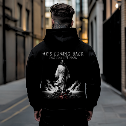 tattooed streetwear man with back facing camera showing backside of a christian hooded sweatshirt with an image of jesus 