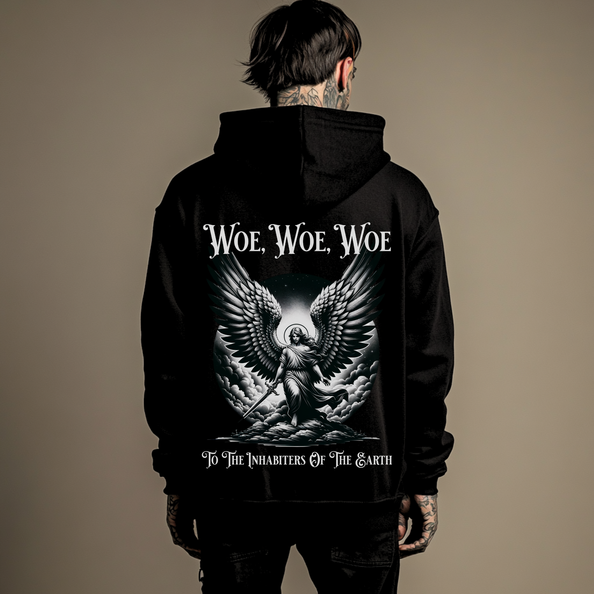 man wearing a christian graphic hoodie that says woe to the inhabiters of the earth from revelation in the bible