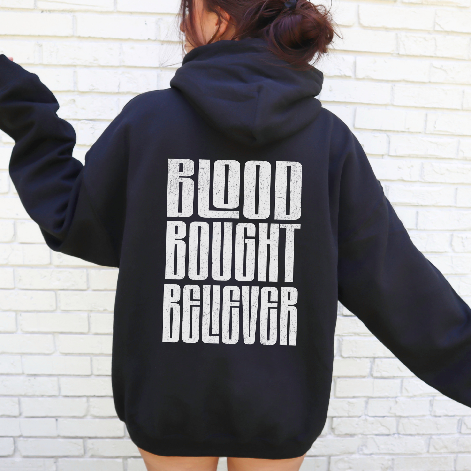 black best selling christian hoodie that says blood bought believer on back