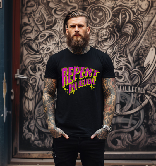 a tattooed man wearing christian streetwear, a black crew neck short sleeve Christian graphic tee that says repent and believe