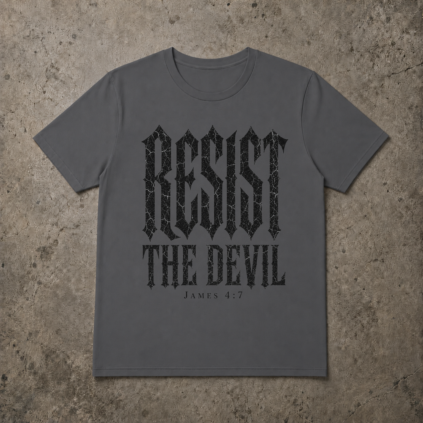 A grey short-sleeve t-shirt with a distressed white graphic print reading 'SET APART' and 'A CHOSEN GENERATION 1 PETER 2:9' underneath, laid flat on a textured gray concrete background.